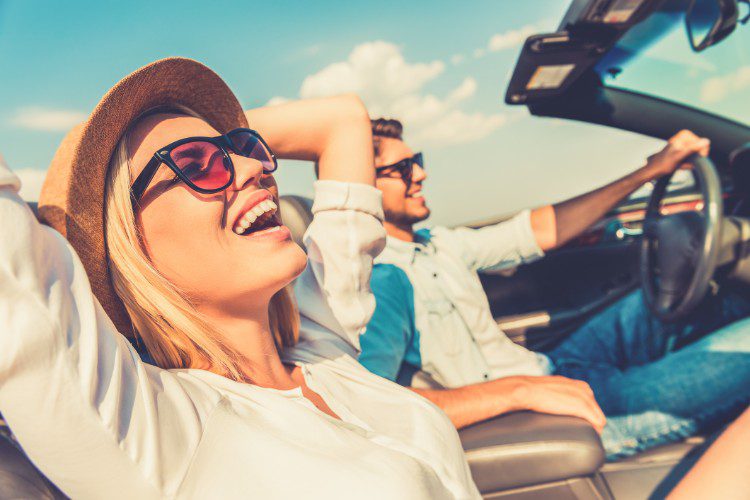 couple riding in car having the time of there life